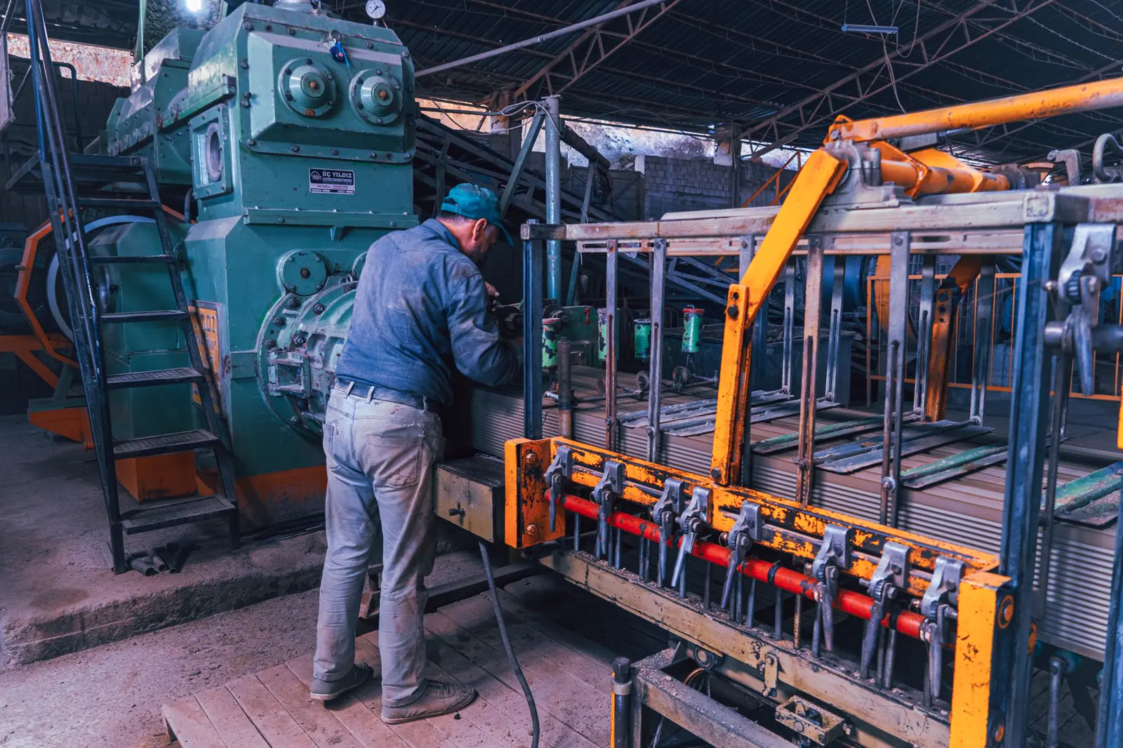 a worker operating machinery in a workshop
