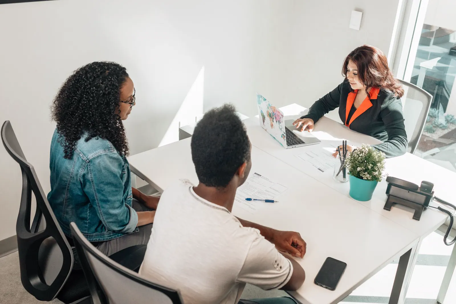 professionals discussing plans in an office